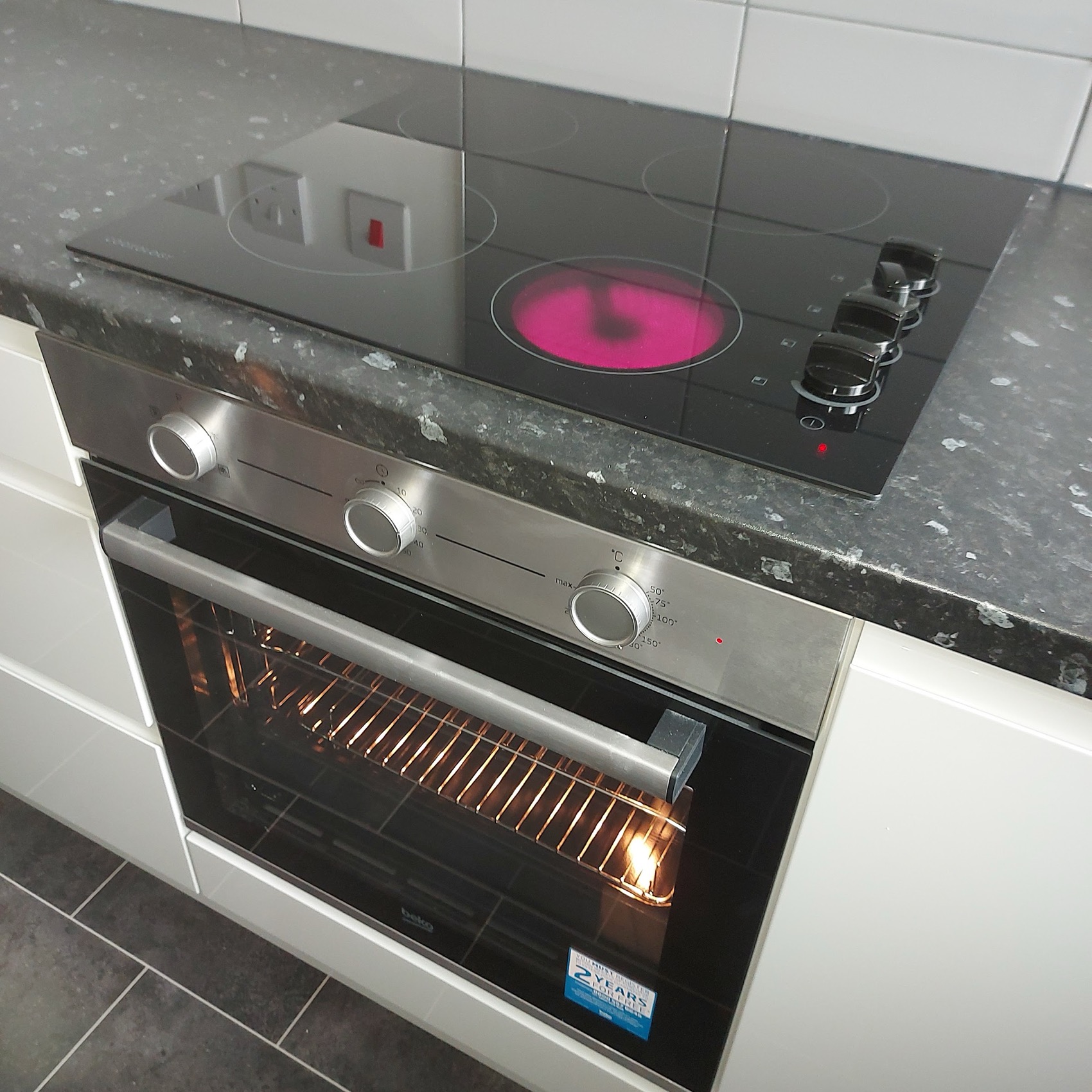 Kitchen handover — hob and oven connected, tested and working, with the cooker circuit sized for what is actually fitted.
