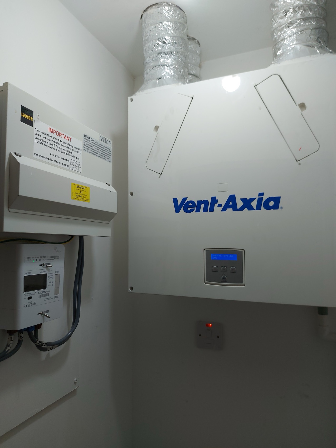 Mechanical ventilation unit supplied and isolated on its own way, alongside the meter position in a utility cupboard.